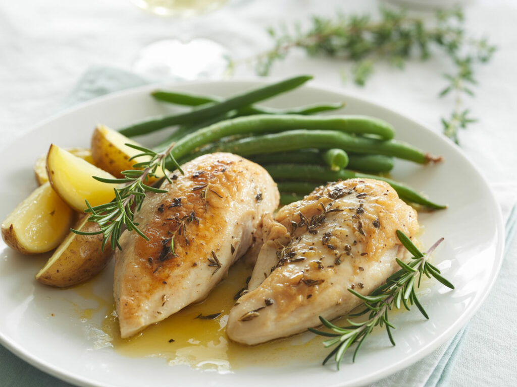 Lemon herb chicken with baby potatoes and green beans in crockpot