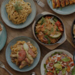 Colorful spread of quick and easy dinner recipes including pasta, chicken fajitas, and stir-fry dishes ready in 30 minutes