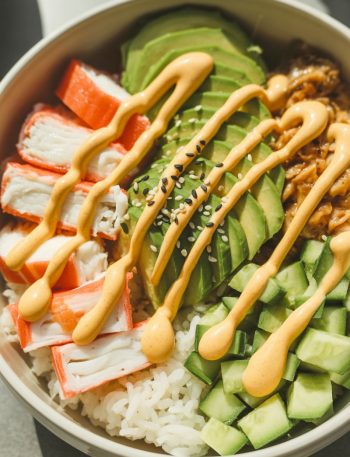California roll sushi bowls with crab, avocado, and cucumber over rice