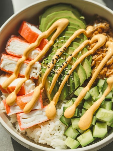California roll sushi bowls with crab, avocado, and cucumber over rice