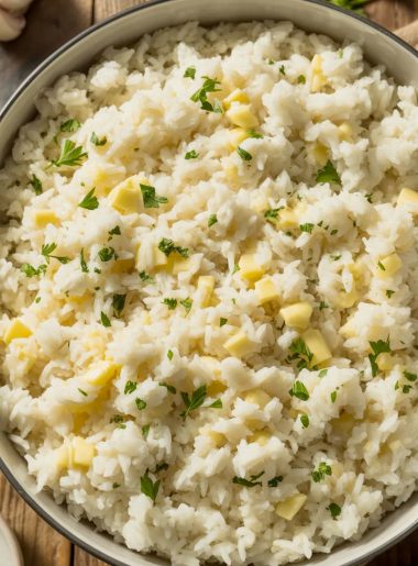 Bowl of fluffy garlic butter rice with fresh parsley garnish showing perfectly separated grains