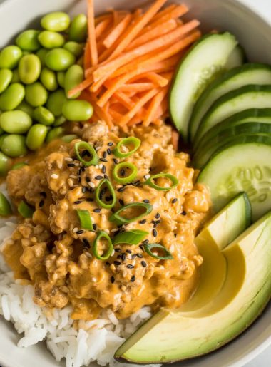 Ground turkey bang bang rice bowl with creamy sauce, vegetables and rice in white bowl